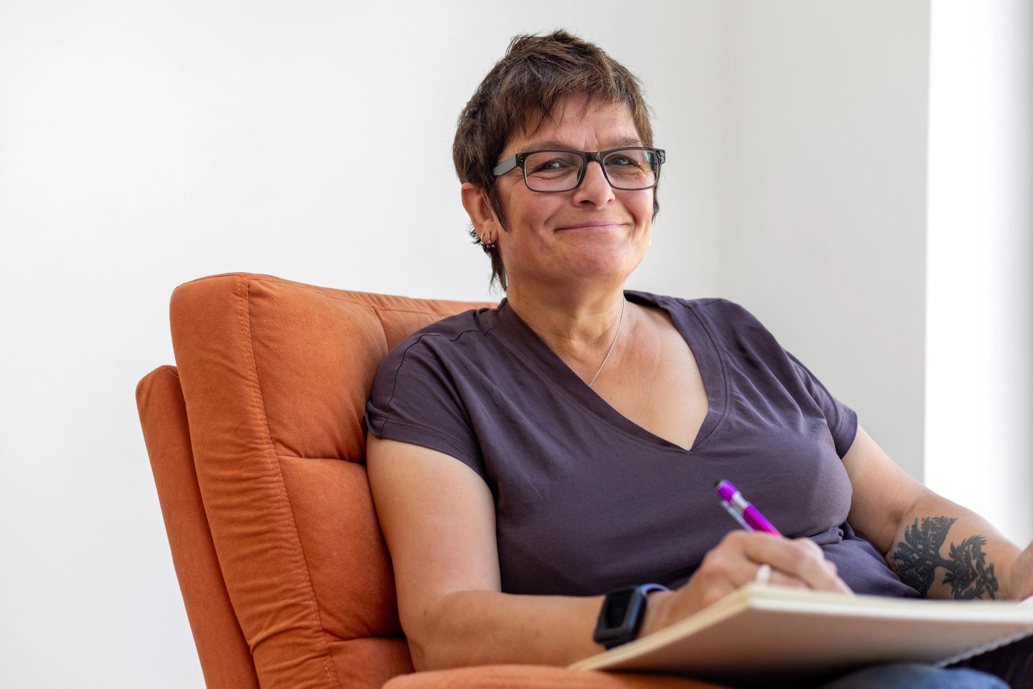 Author writing in a notebook